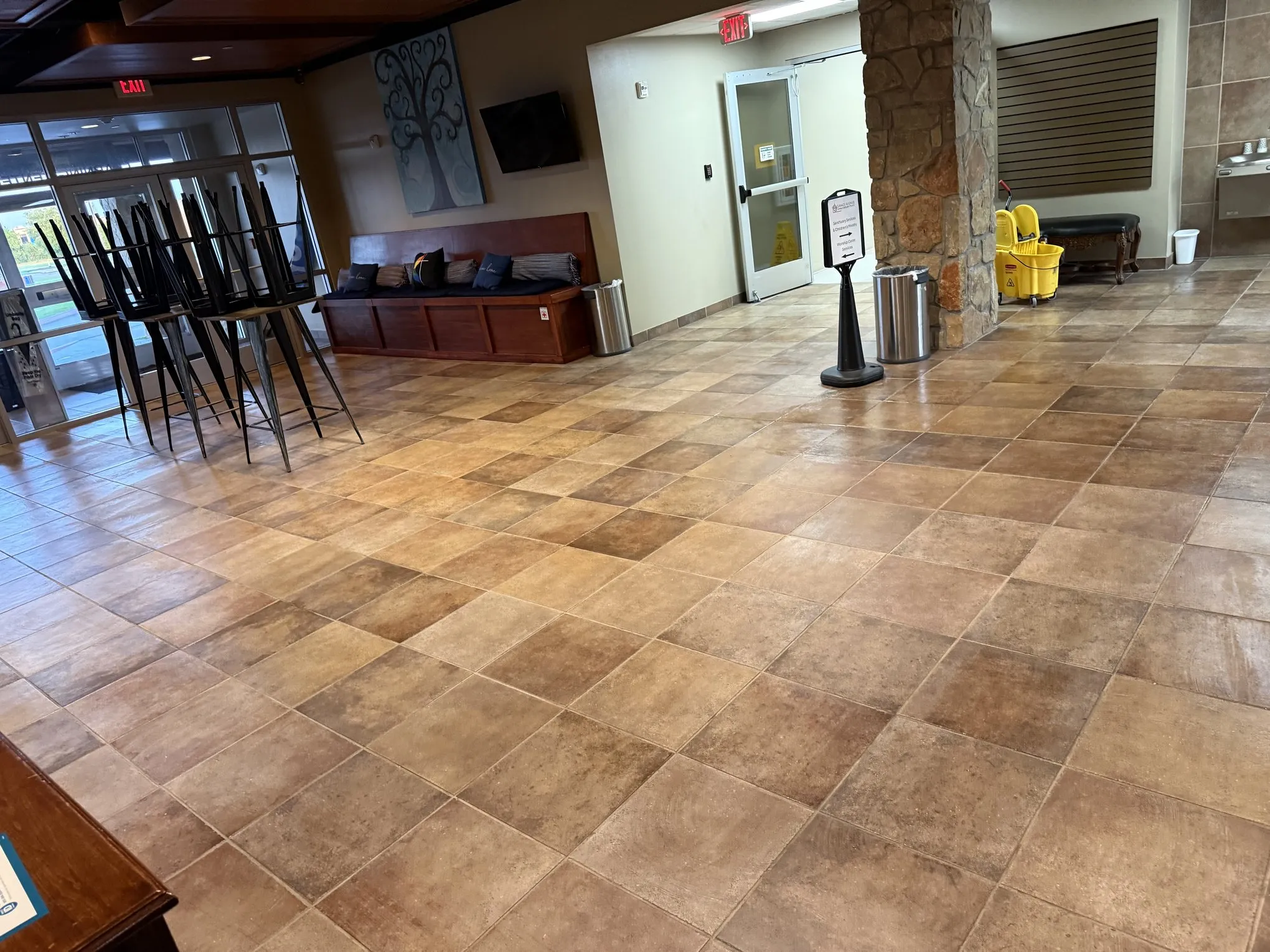 Commercial lobby with clean tile floor maintained by Frisco Brothers